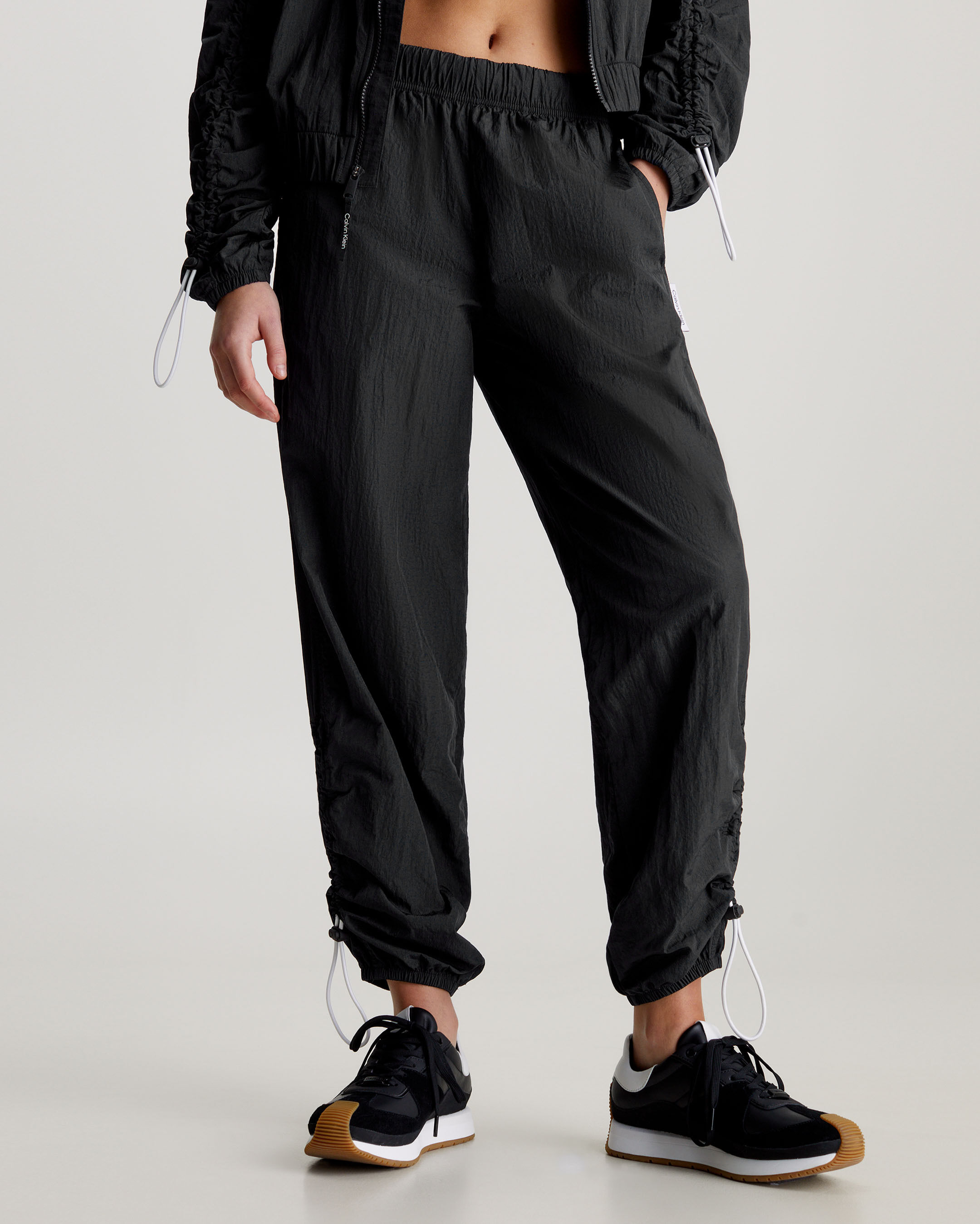 All black tracksuit bottoms top